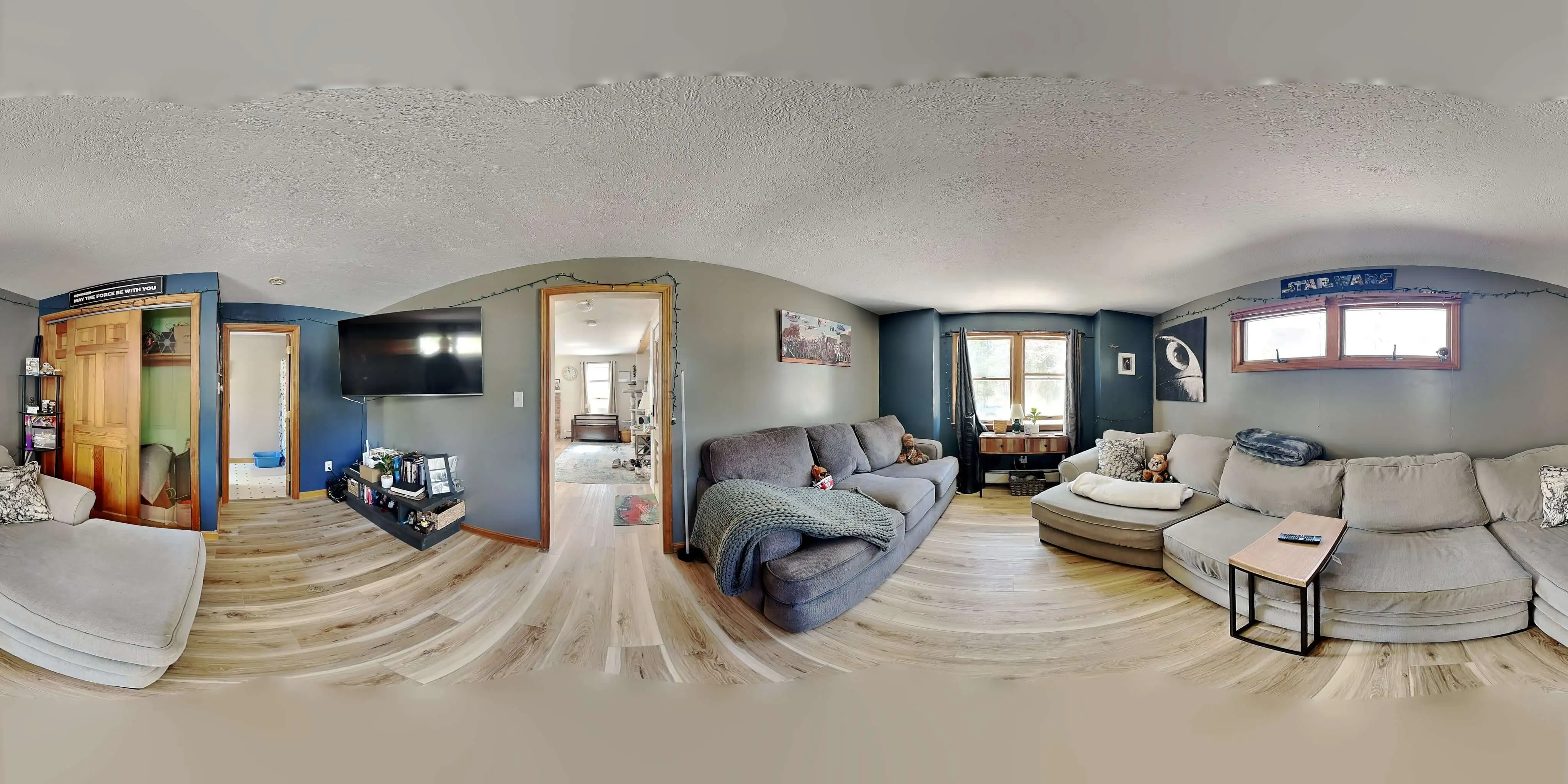 360-degree panoramic image of an empty living area used for virtual decluttering and immersive property tours.