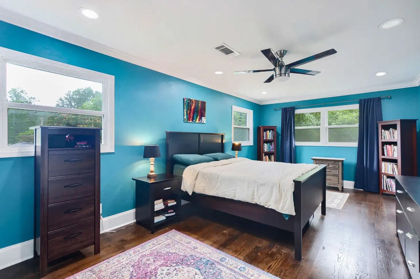After photo of a modern, virtually renovated living room with updated paint, new flooring, and stylish virtual staging furniture with Pre-model studio